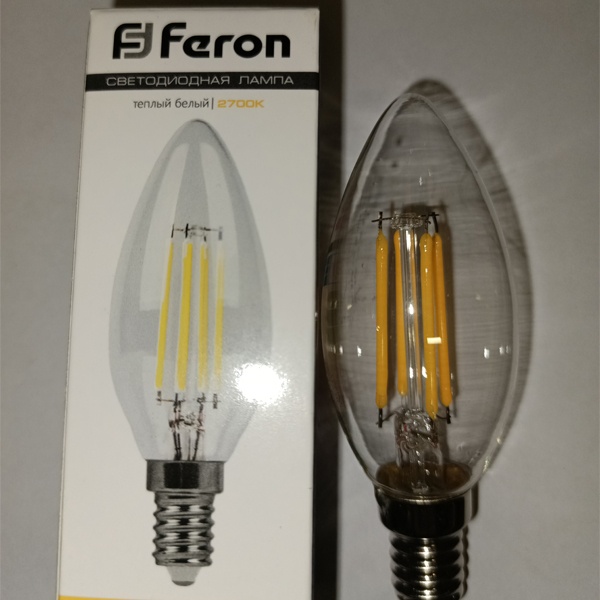 Энергосберегающая LED лампочка свеча с нитевидными светодиодами, мощностью 7 Ватт, с цоколем E14, теплый свет, прозрачная колба