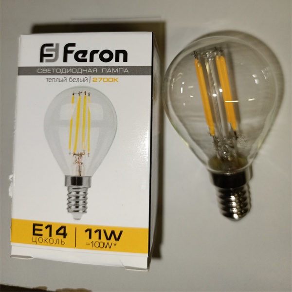 Филаментная лампочка шарик Ферон с нитевидными светодиодами, мощностью 11 Ватт, с цоколем E14 (миньон), теплый свет, прозрачная колба