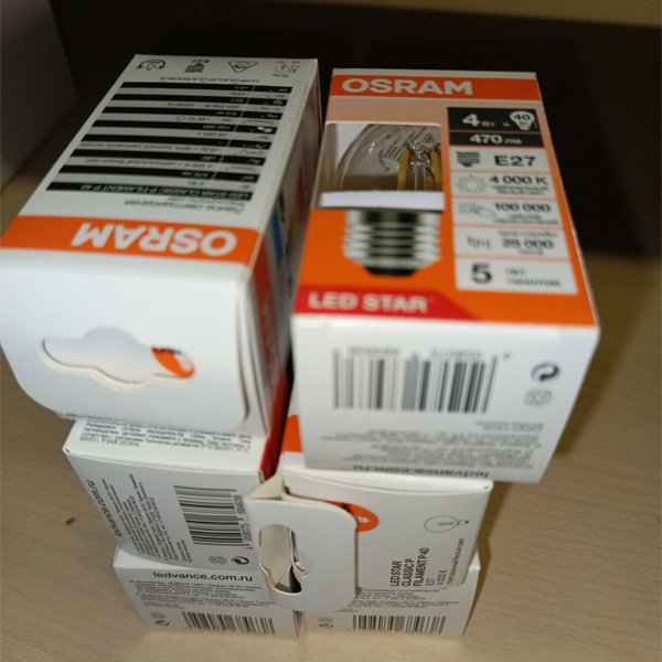 Филаментная лампочка формы шарик с нитевидными светодиодами Осрам мощностью 4 Ватта, с цоколем E27, нейтральный белый свет, прозрачная колба