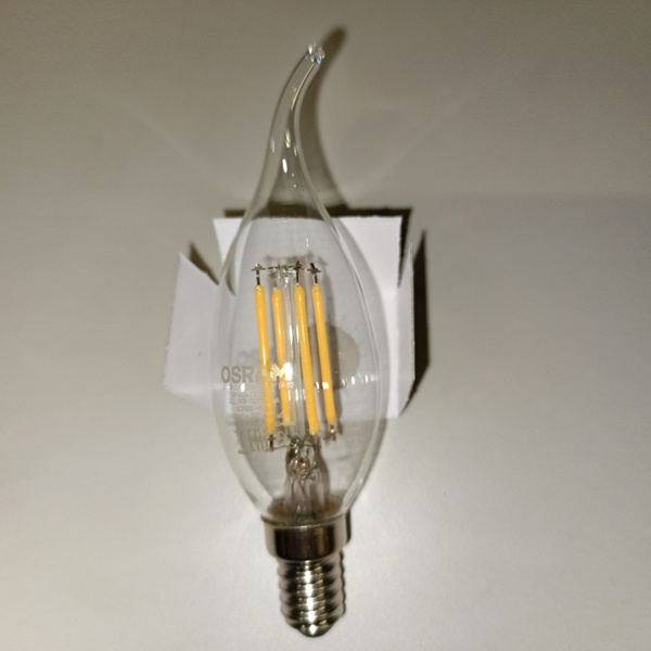 Филаментная лампочка формы свеча на ветру с нитевидными светодиодами Осрам мощностью 5 Ватт, с цоколем E14 (миньон), теплый свет, прозрачная колба