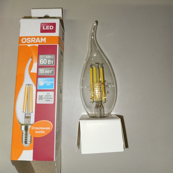 Филаментная лампочка формы свеча на ветру Осрам с нитевидными светодиодами, мощностью 5 Ватт, с цоколем E14, нейтральный белый свет, прозрачная колба