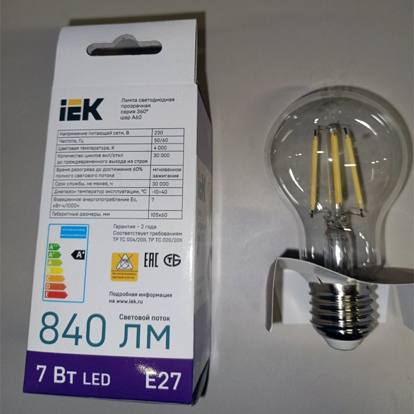 Филаментная лампочка груша с нитевидными светодиодами мощностью 7 Вт с цоколем E27 нейтральный белый свет прозрачная колба