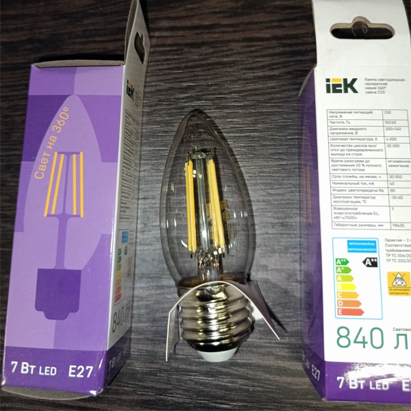 Энергосберегающая LED лампочка свеча с нитевидными светодиодами, мощностью 7 Ватт, с цоколем E27, нейтральный белый свет, прозрачная колба