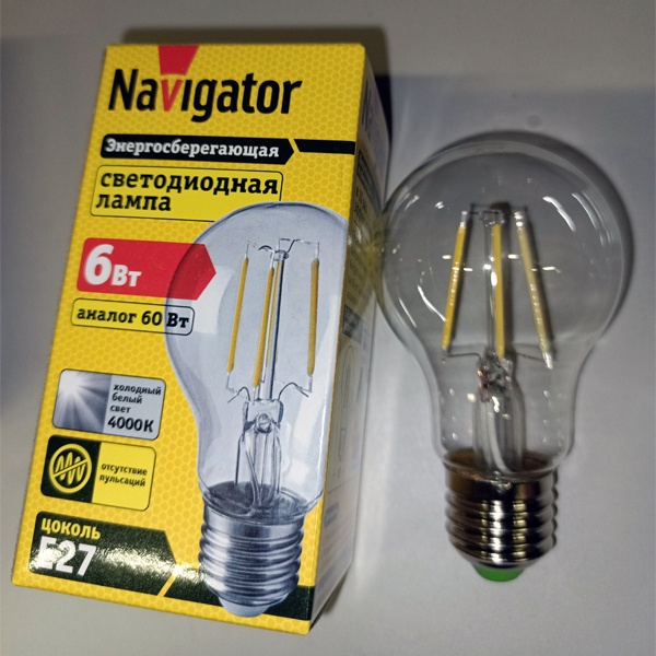 Филаментная лампочка Навигатор с нитевидными светодиодами, мощностью 6 Ватт, с цоколем E27, нейтральный белый свет, прозрачная колба