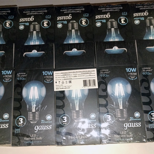 Филаментная лампочка груша с нитевидными светодиодами мощностью 10 Вт с цоколем E27 нейтральный белый свет прозрачная колба