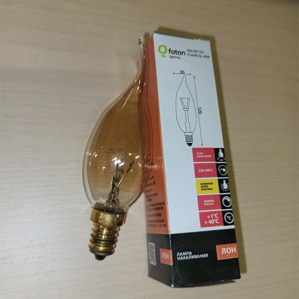Обычная вольфрамовая лампа формы свеча на ветру мощностью 40 Вт на 220 Вольт с цоколем E14 миньон общего назначения